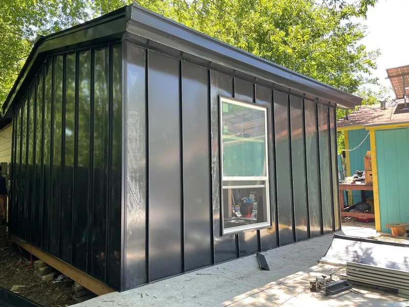 Black standing seam metal wall panels for Roof Inspection in Northglenn