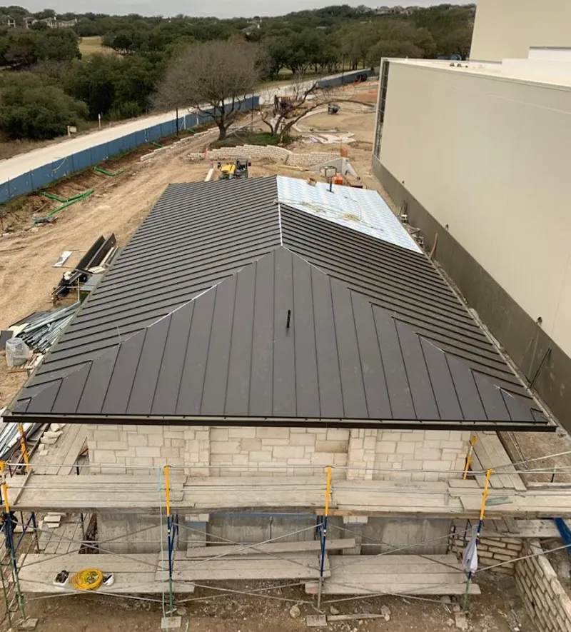 Metal roof new construction with scaffolding in Northglenn